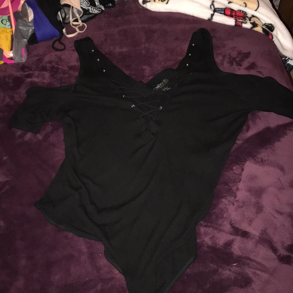 Black body suit with cut out in front